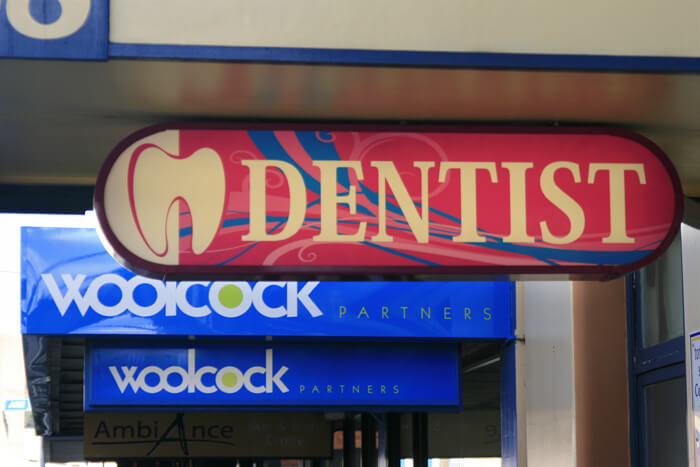 An extracted tooth- dental clinic sign.