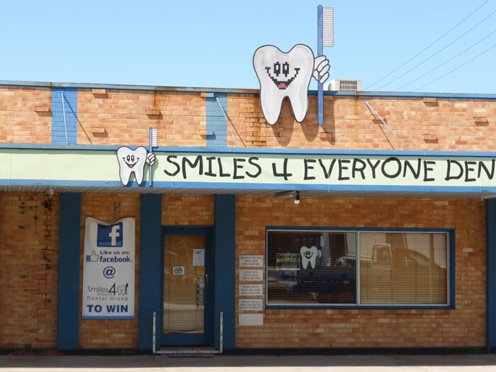 Extracted tooth clones armed with tooth brushes all over Smiles 4 Everyone Cosmetic Dental shop-front in Sarina, QLD.